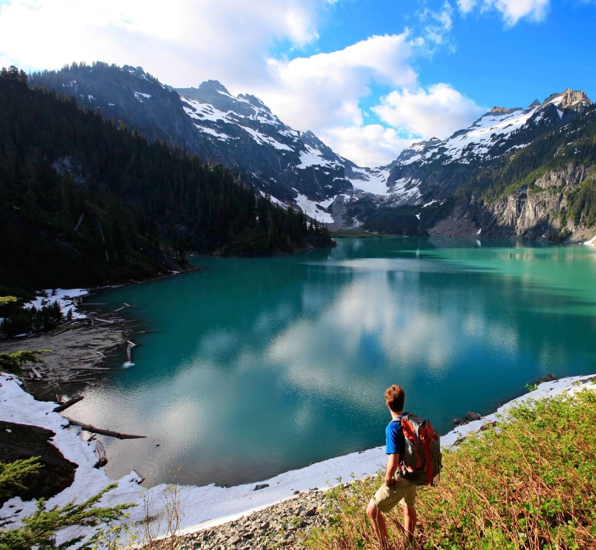 A hiker looking out over at Blanca Lake