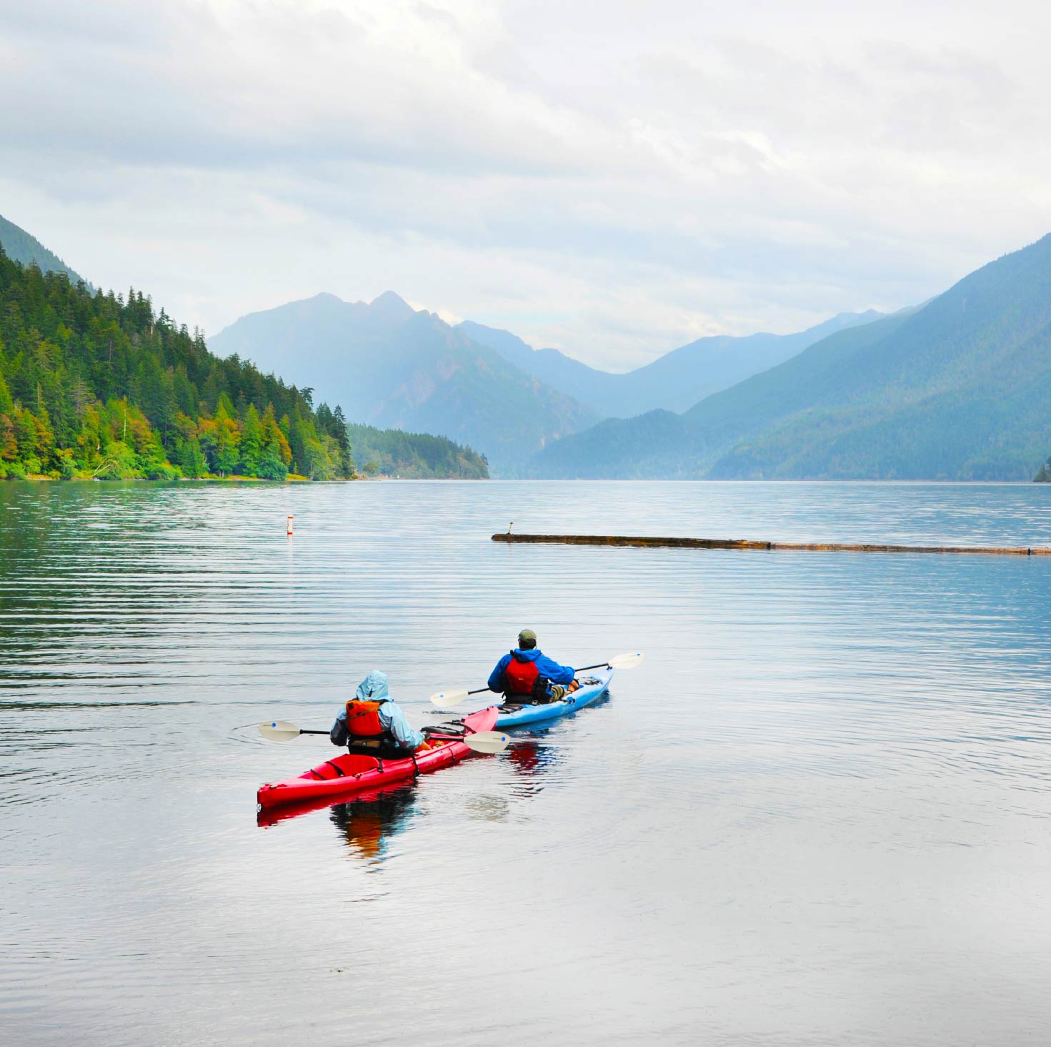 Two kayaks out on a mountain lake.