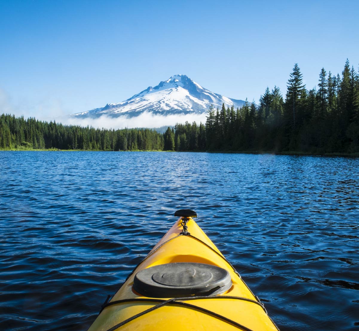 A yellow kayak in Trillium Lake, Mt. Hood, Oregon.