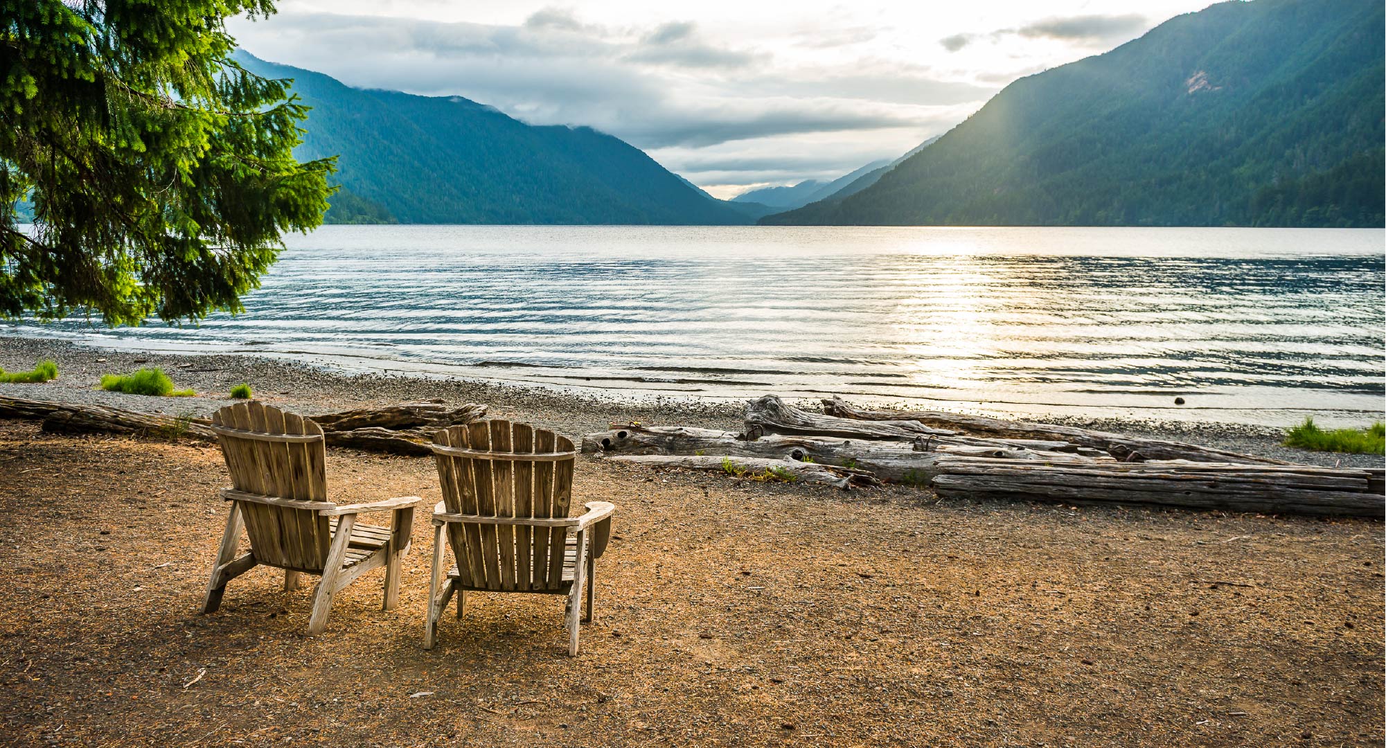 Two adirondack chairs looking out on Crescent Lake